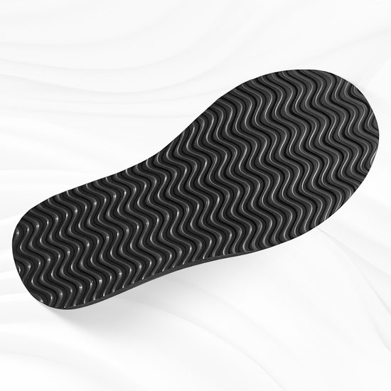 Zwarte anti-slip zool van een pantoffel met golvend profiel.
