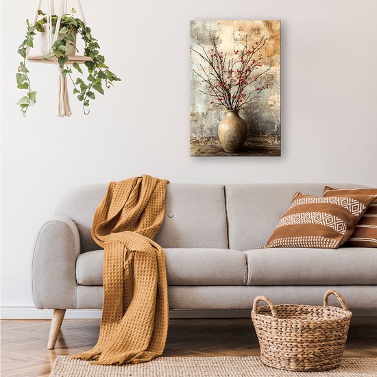 Canvas print van takken met rode besjes in een vaas, tegen een rustieke muur, boven een bank.