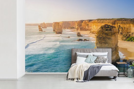 Behang - Fotobehang kalksteen rotsen in de zee bij Australië - Breedte 330 cm x hoogte 220 cm