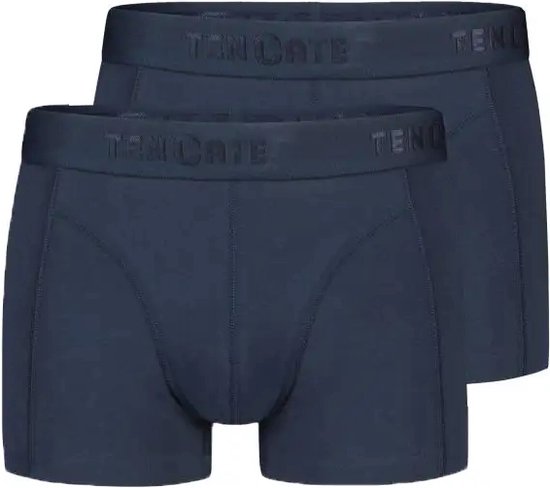 Twee donkerblauwe shorty's van Ten Cate met logo op de tailleband.