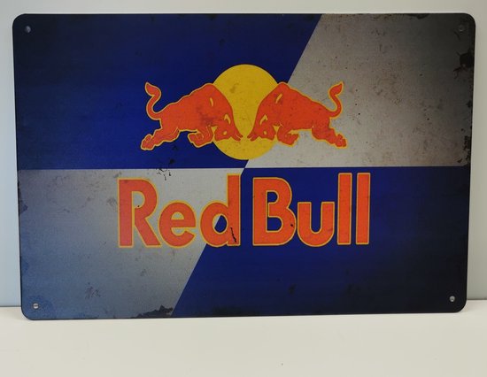 Plaque publicitaire rétro Red Bull en métal avec deux taureaux rouges et un cercle jaune.
