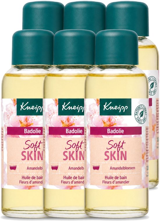 Zes flessen Kneipp Soft Skin amandelbloesem badolie met groene doppen en roze bloemen op het etiket.