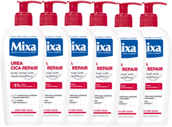 Zes flessen Mixa Urea Cica Repair+ bodylotion met pompdispenser, op een zwarte achtergrond.