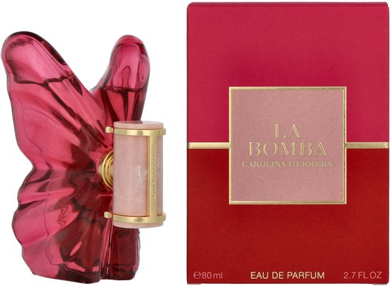 Een roze vlinderparfumflesje met een rood en roze doosje. "LA BOMBA CAROLIN HERRERA EAU DE PARFUM 80 ml 2.7 FL OZ".