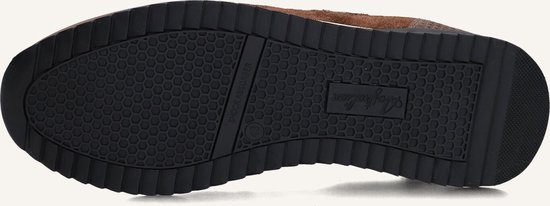 Onderkant van bruine herensneakers met "Australian" logo en "Shock Absorber" opdruk.