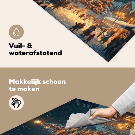 Inductiebeschermer met kerstdorp-print wordt schoongemaakt met een doek.