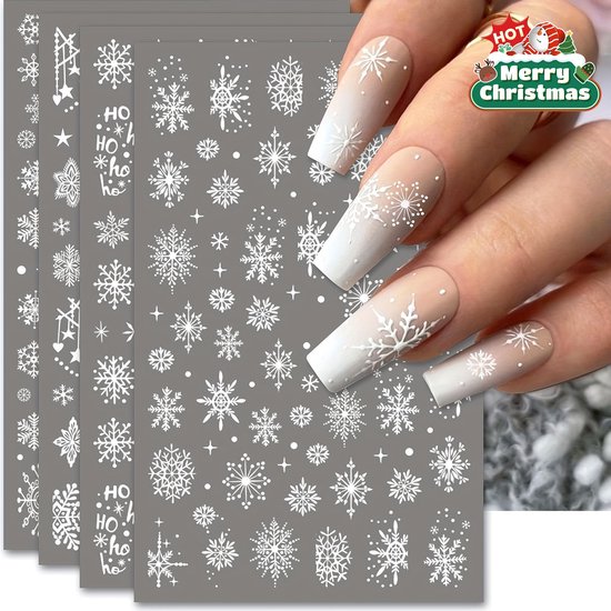 Vellen met witte sneeuwvlok- en 'ho-ho'-stickers, op nagels met een beige naar witte ombre-stijl.