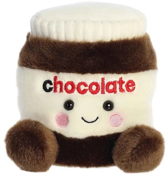 Peluche douce de couleur crème en forme de pot de pâte à tartiner au chocolat, avec un bouchon blanc, des détails marron et le mot 'chocolate'.