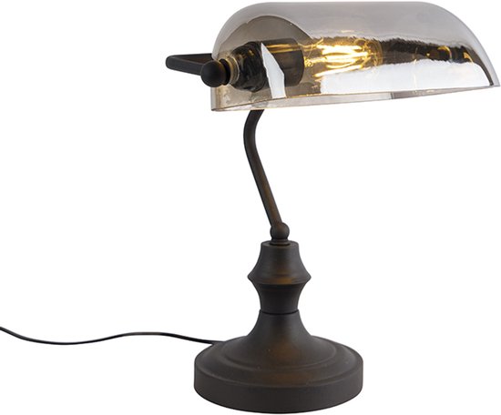 Lampe de banquier noire avec abat-jour en verre gris et ampoule visible.