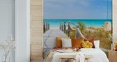 Fotobehang Pad Op Een Caribisch Strand - Vliesbehang - 460 x 300 cm