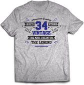 34 Jaar Legend - Feest kado T-Shirt Heren / Dames - Antraciet Grijs / Donker Blauw - Perfect Verjaardag Cadeau Shirt - grappige Spreuken, Zinnen en Teksten. Maat L