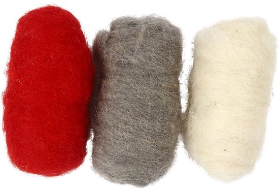 Trois boules de laine cardée : rouge, grise et crème.