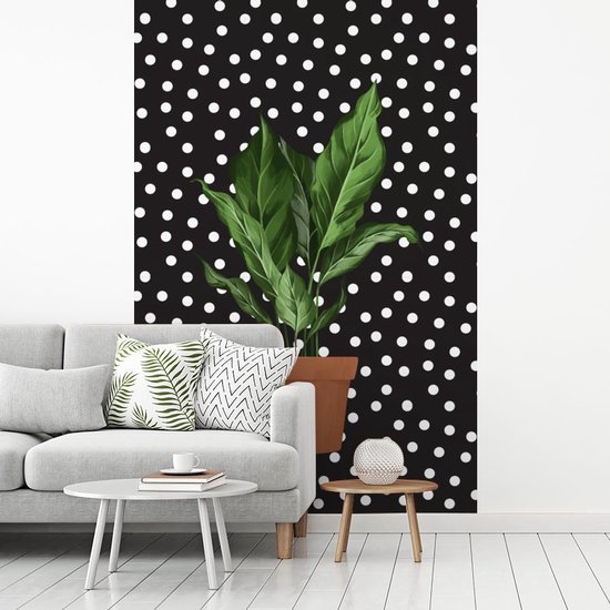 Illustration d'une plant aux feuilles luxuriantes sur fond noir à pois blancs 145x220 cm