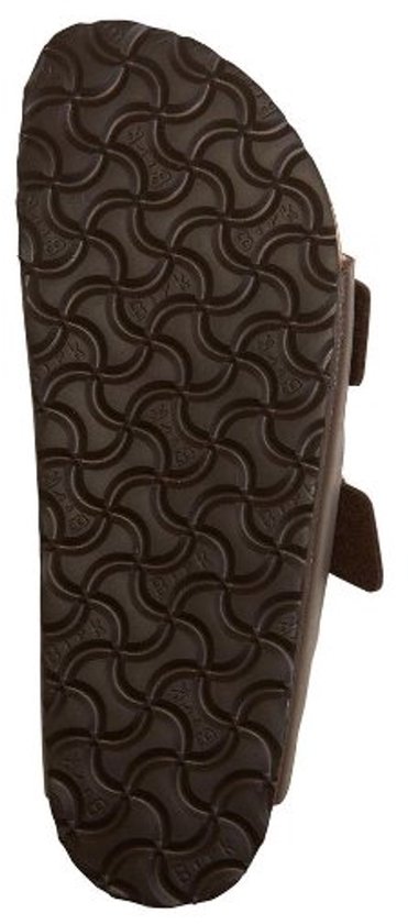 Bruine Birkenstock slipper, onderkant met golvend profiel.