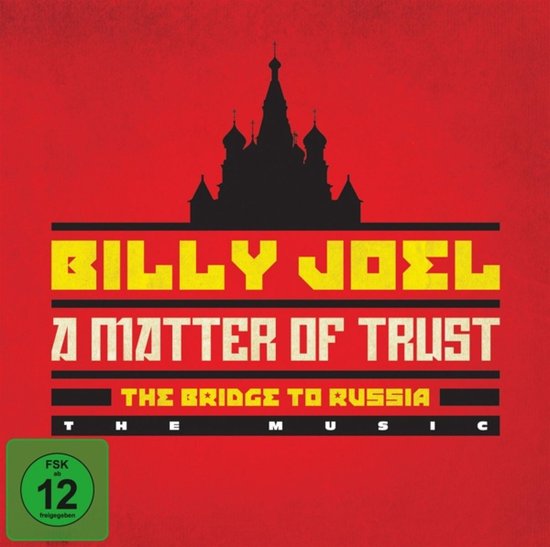 Billy Joel 'A Matter of Trust: The Bridge to Russia' albumhoes met rode achtergrond, zwarte opdruk en FSK 12 logo.