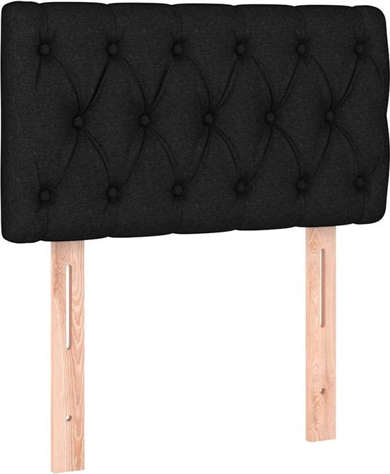 Tête de lit rembourrée noire avec capitonnage et supports de fixation en bois.