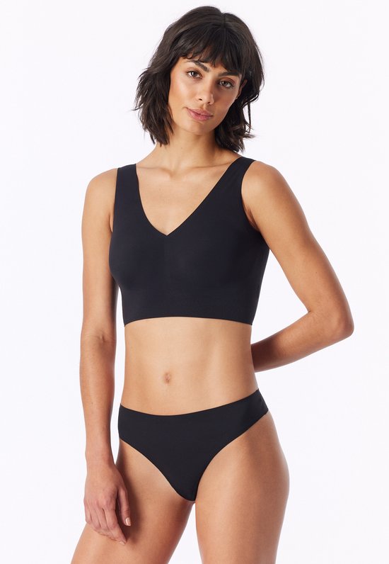 Zwarte bustier met V-hals, gedragen door een model, met de hand in de rug.