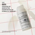 Een flesje Olaplex No.5 Leave-In Conditioner met een kam ernaast.