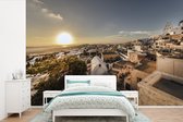 Behang - Fotobehang Zonsondergang over Pyrgos Santorini - Breedte 360 cm x hoogte 240 cm