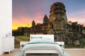 Behang - Fotobehang Zonsopgang in Angkor Wat in Cambodja - Breedte 420 cm x hoogte 280 cm
