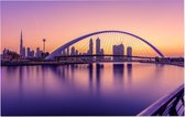 Zonsopkomst zorgt voor een paarse gloed in Dubai - Foto op Forex - 90 x 60 cm