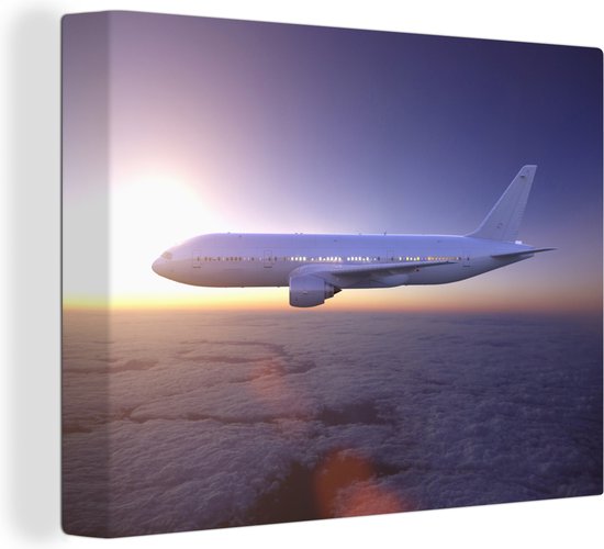 Canvas Schilderij Een vliegtuig boven een mooi wolkengordijn - 120x90 cm - Wanddecoratie