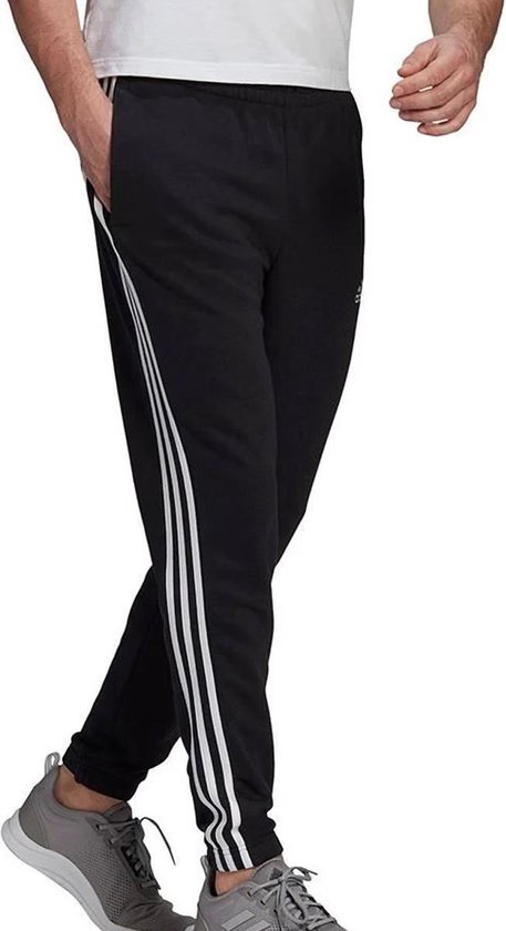 Adidas essentials terry 3-stripes broek in kleur zwart/wit. |