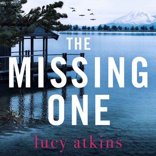 Boek 'The Missing One' door Lucy Atkins, met een sereen meer, pier en besneeuwde berg.