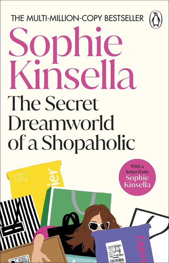 Boekcover van 'The Secret Dreamworld of a Shopaholic' door Sophie Kinsella. Een vrouw met zonnebril tussen paarse, gele en groene tassen.