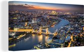 Canvas Schilderij Luchtfoto van Londen met de Tower Bridge tijdens schemering - 80x40 cm - Wanddecoratie