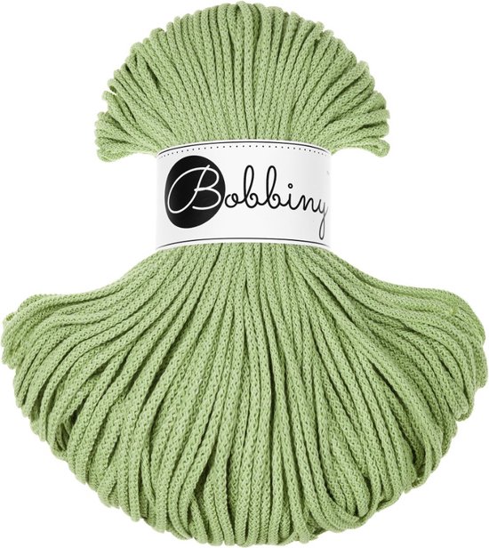 Bobbiny Junior gevlochten koord in de kleur matcha groen. Het koord is 3 mm dik en opgerold tot een waaier.