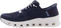 Donkerblauwe Skechers sneaker met witte veters, witte zool en opdruk 'SKECHERS SLIP-INS'.