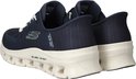 Achterkant van twee blauwe Skechers Slip-ins Glide Step instappers met crèmekleurige zolen.