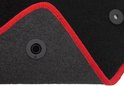 Zwarte automat met rode bies en twee bevestigingsringen.