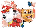 Un puzzle partiellement assemblé de la Pat' Patrouille avec les chiots Chase et Marshall sur fond rose.