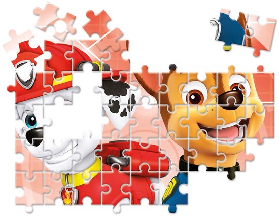 Un puzzle partiellement assemblé de la Pat' Patrouille avec les chiots Chase et Marshall sur fond rose.