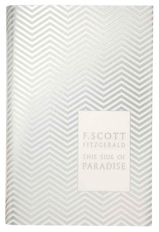 Boek 'This Side Of Paradise' met zilveren visgraatpatroon op de kaft.