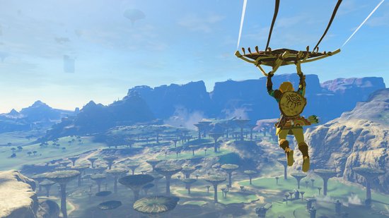 Link zweeft met een parachute boven een uitgestrekt, groen landschap met bizarre bomen en zwevende rotsen.