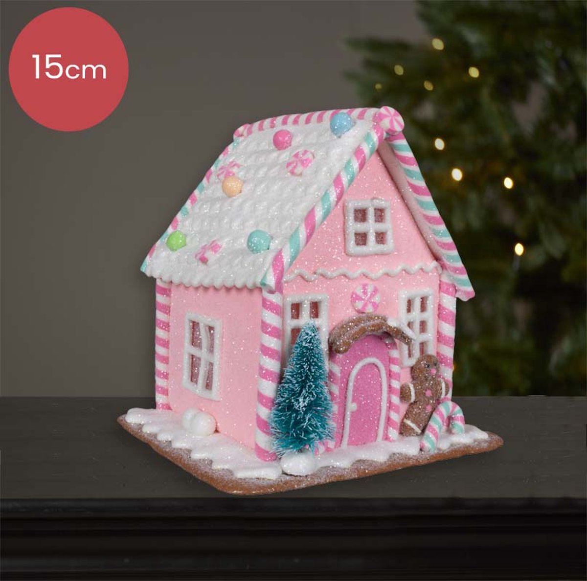 Roze Peperkoekhuisje versierd met sneeuw en snoepgoed - 15cm