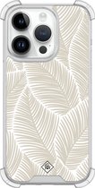 Casimoda® hoesje - Geschikt voor iPhone 14 Pro - Palmy Leaves Beige - Shockproof case - Extra sterk - Siliconen/TPU - Bruin/beige, Transparant