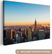 Canvas schilderij 140x90 cm - Wanddecoratie New York - Skyline - Zonsondergang - Muurdecoratie woonkamer - Slaapkamer decoratie - Kamer accessoires - Schilderijen