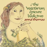 Illustratie van een vrouw met een citroenschijf en kersen in haar haar, tekst: The Vegetarian Epicure book two, anna thomas.