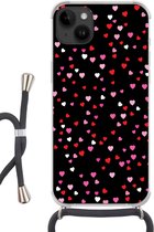 Geschikt voorApple Iphone 14 Plus - Crossbody Case - Een illustratie met hartjes op een zwarte achtergrond - Siliconen - Crossbody - Backcover met Koord - Telefoonhoesje met koord - Hoesje met touw