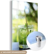 MuchoWow® Glasschilderij 80x120 cm - Schilderij acrylglas - Sluit omhoog van mojitococktail in glas - Foto op glas - Schilderijen