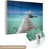 MuchoWow® Glasschilderij 120x80 cm - Schilderij acrylglas - Frans-Polynesie aanlegsteiger - Foto op glas - Schilderijen