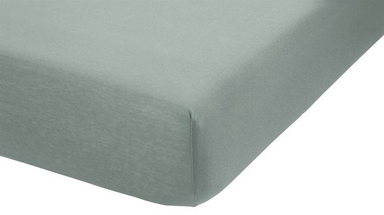 Blauw jersey split-topper hoeslaken, strak gespannen.