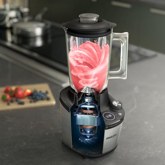 Dwarsdoorsnede van een Philips blender die een roze smoothie mixt.