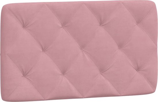 Tête de lit rose avec motif en losanges et boutons.