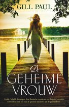 Boekomslag van "De geheime vrouw" door Gill Paul. Vrouw in lang groen kleed loopt op een houten steiger aan het water.