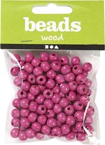 Houten kralen. roze. d: 10 mm. gatgrootte 3 mm. 20 gr/ 1 doos. 70 stuk